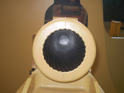 The image shows a view down the barrel of a cannon, emphasizing its rifling. Rifling in the barrel of a canon causes the projectile to spin just as is the case for rifles (hence the name for the grooves in the barrel). (credit: Elsie esq., Flickr)